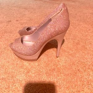 Multicolored glitter open toe heels.